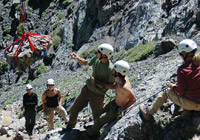 Photo of crew lifting rocks with cable