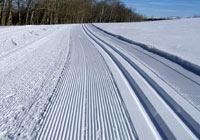 Photo of grooved tracks in snow for ski trail