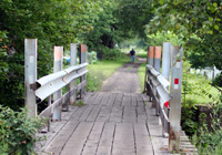 Photo of wood-decked bridge with steel railings