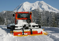 Photo of tracked snow trail maintenance machine