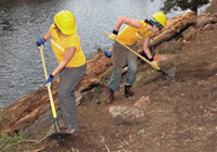Photo of trail crew at work on dirt trail